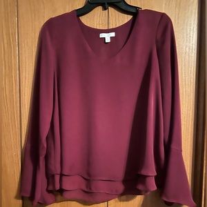 Wine colored long sleeve blouse.